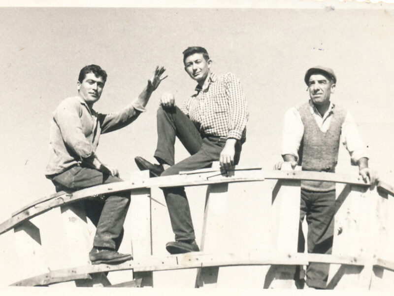 Three boatbuilders on a liberty type boat