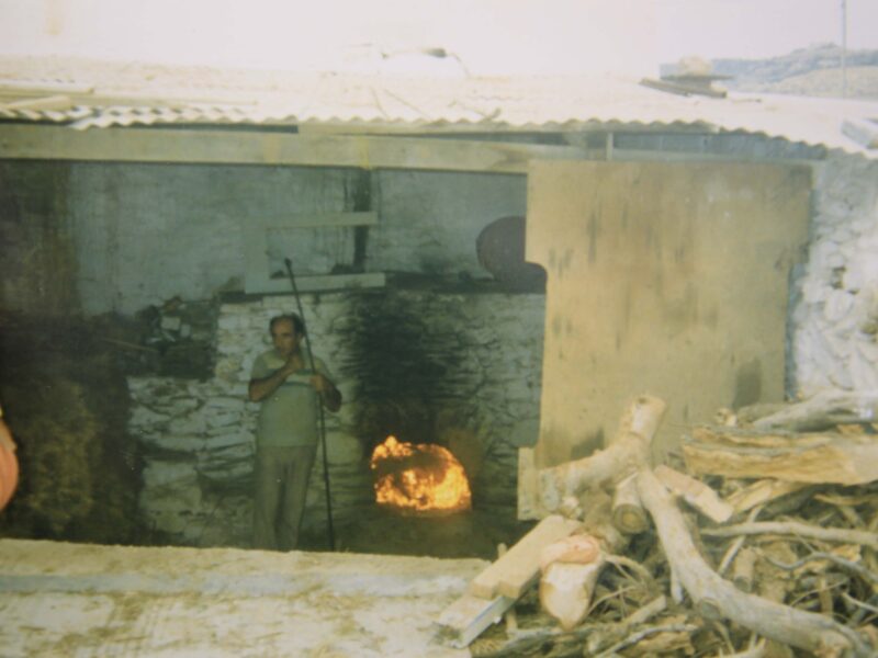 Nikos Exylzes preparing wood fired kiln in Platys Gialos, c. 1980.